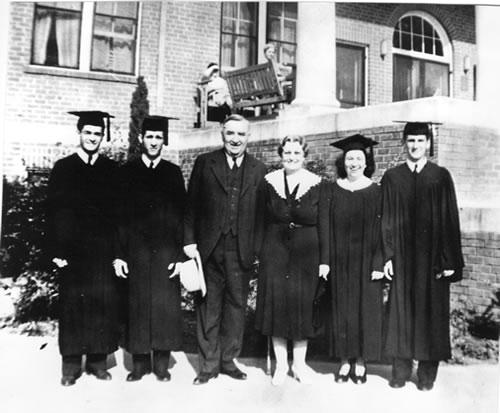 Left to right â€” Graduates with Dr. and Mrs. Forrest